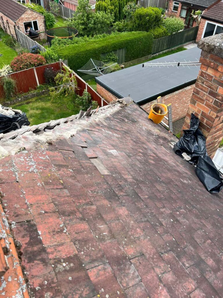 This is a photo of a roof where the hip tiles have been removed, and are just about to be replaced. Works carried out by Calverton Roofing Repairs